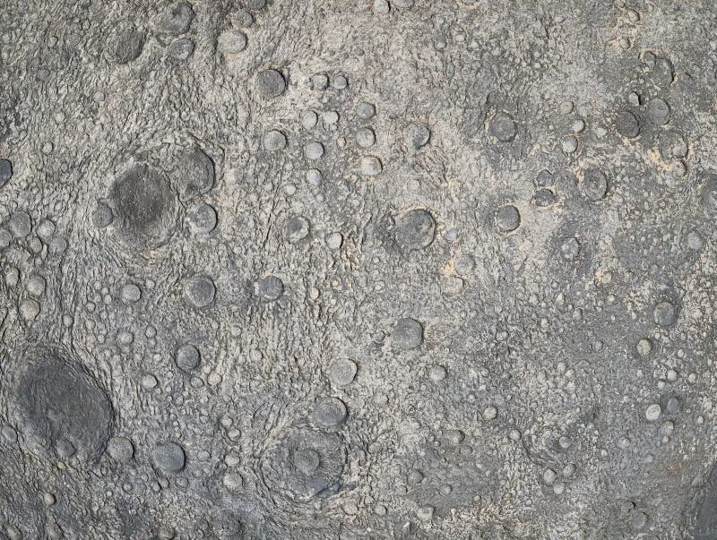A magnified view of lunar regolith, or moon dust. This abrasive, electrically charged material poses